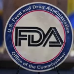 The Food and Drug Administration seal is seen at the Hubert Humphrey Building Auditorium in Washington, April 22, 2025. (AP Photo/Jose Luis Magana)